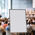 sign, blank, interior, presentation, conference, audience, stand, focus, blurred background, event, hall, lights, seminar, meeting, modern, corporate, classic, workshop, formal, person